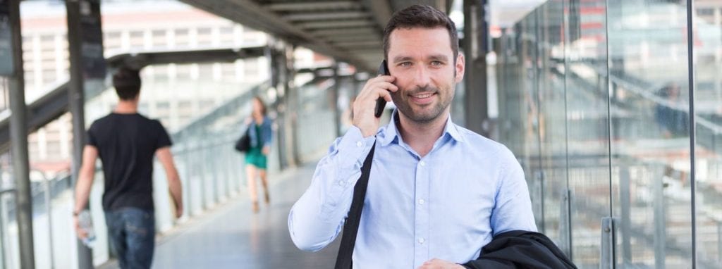 Professional Man on mobile in public space