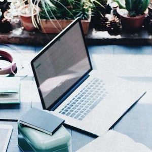 Home office with desk laptop and stationery